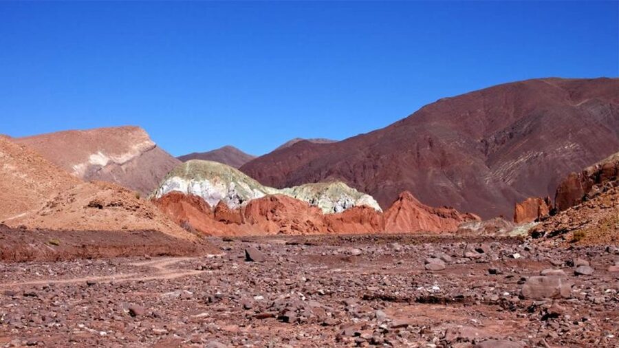 From San Pedro de Atacama: Rainbow Valley Tour - Río Grande adds a local stop, but keep your expectations flexible