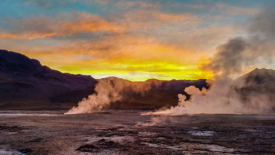 San Pedro de Atacama: El Tatio Geysers & Machuca Lagoon Trip - Walking through the third-largest geyser field